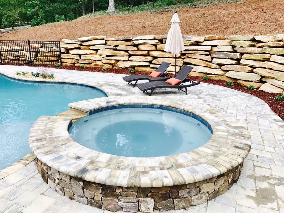 Raised spa and natural stone retaining walls